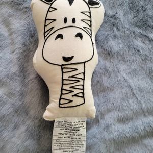 Hobby Lobby cream pillow with black outline of a giraffe